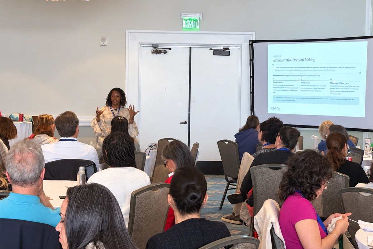 Kanetria leading a professional learning session for a room full of educators